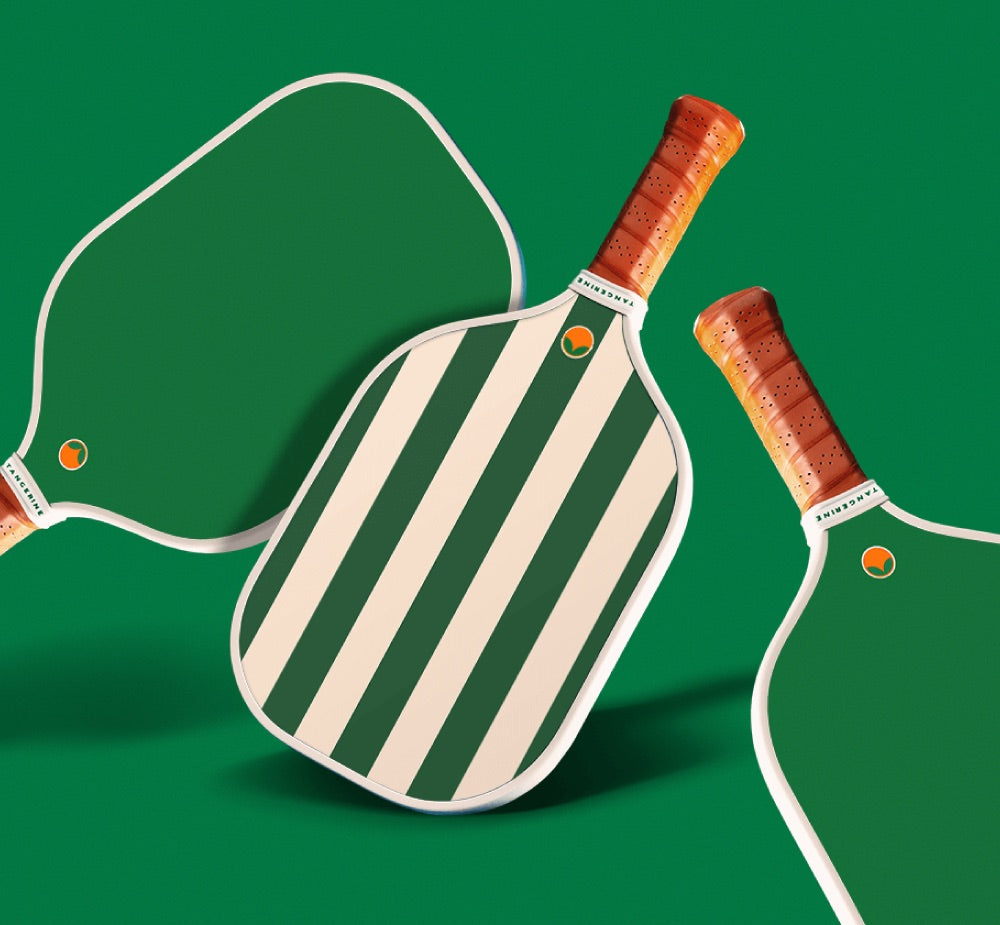 Tangerine's Gardiners Bay pickleball paddle with green backing. 