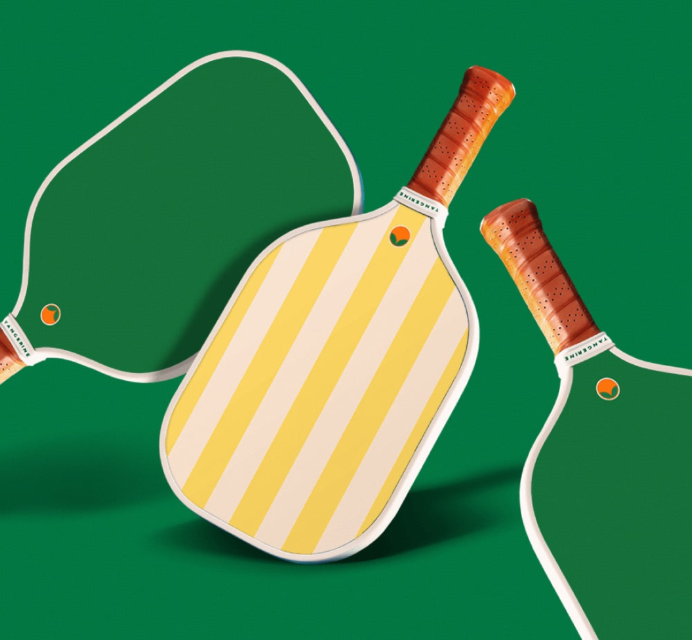 Yellow striped pickleball paddle with green backing. 