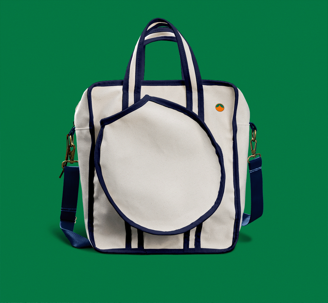 Navy blue pickleball bag with Tangerine logo on green background. 