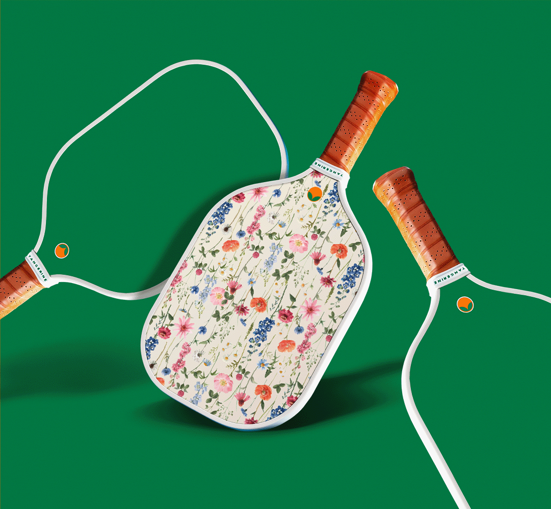 Wildflower decorated pickleball paddle with green backing. 