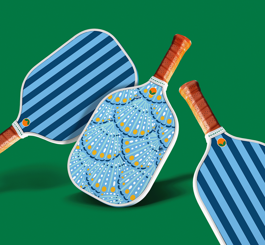 Taormina Pickleball paddle designed by Tangerine.  Features fun and vibrant stripes.