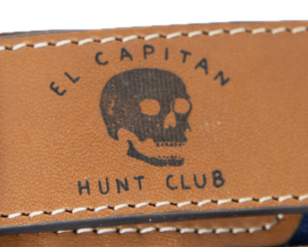 Laser-etched logo on a leather belt tab